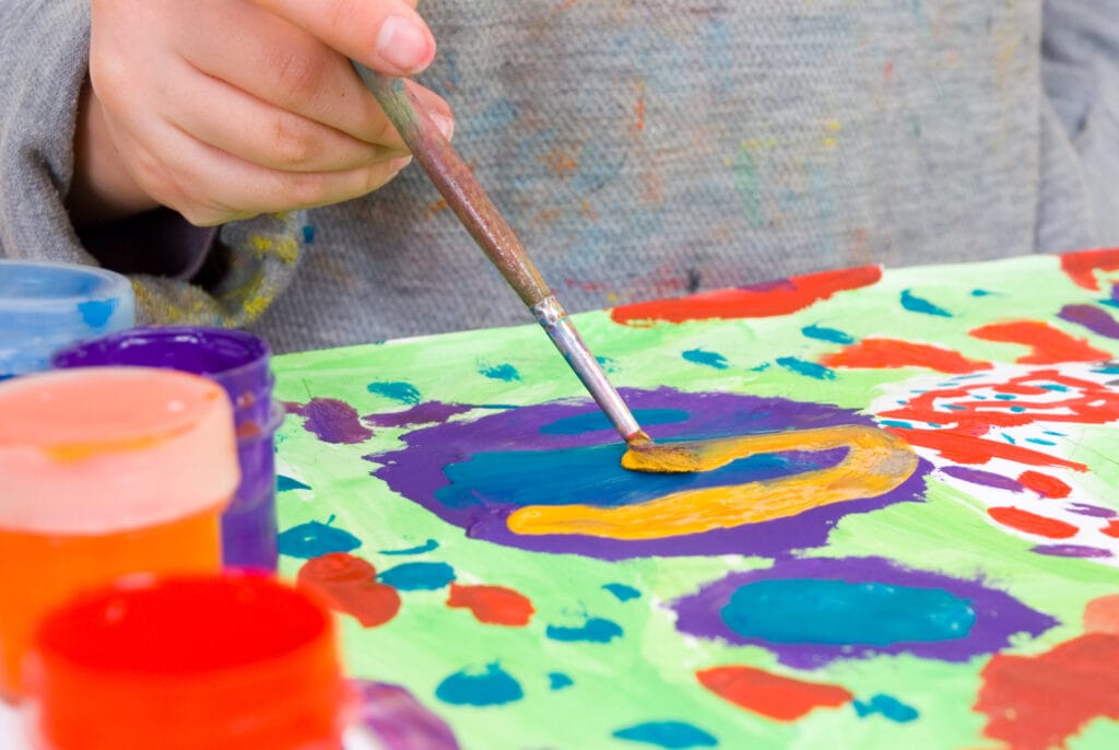 art therapy and paint - Level Up Wellness Group individual painting with different colors of pain, art therapy, Alberta, Canada
