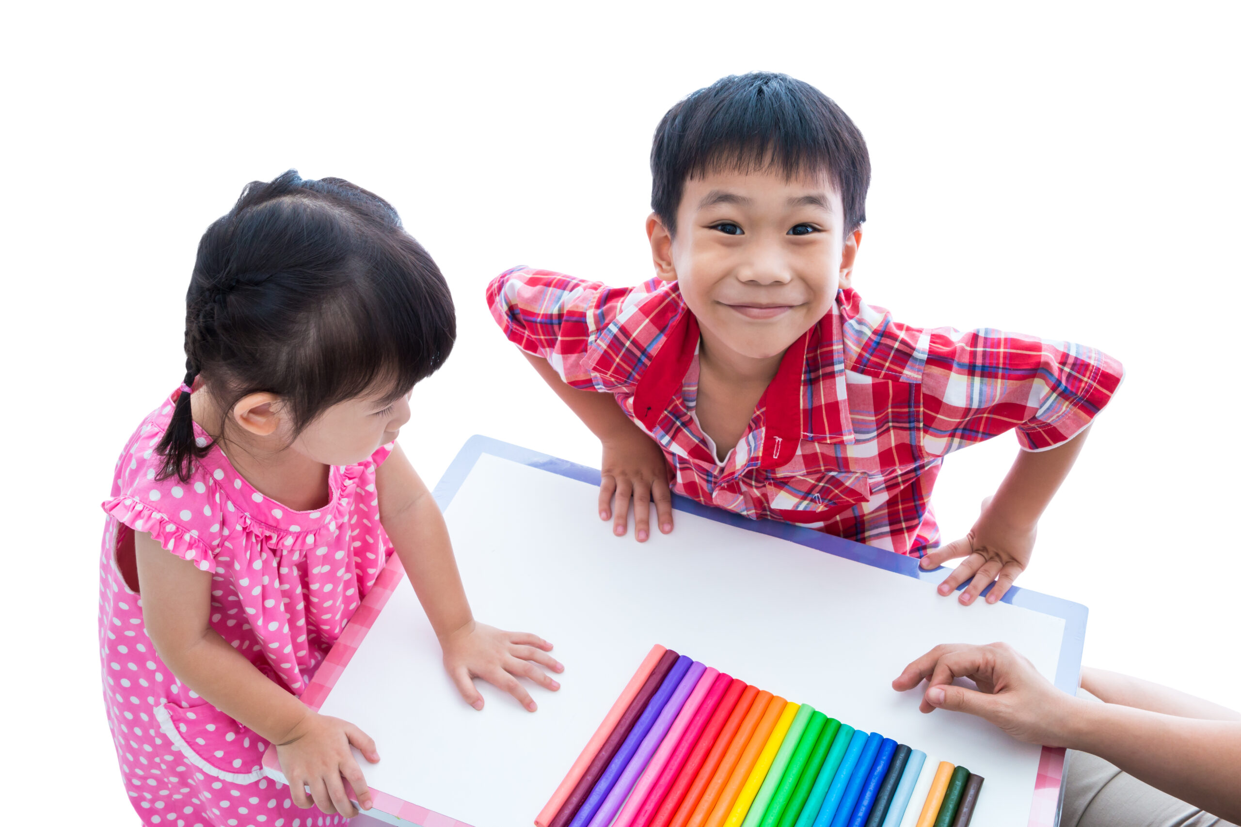 two kids who are looking at clay, art therapy, Alberta, Canada