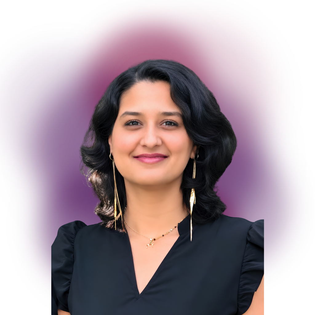 Portrait of a smiling woman with dark hair in a black V-neck top, gold earrings, and a delicate necklace, against a purple gradient background.
